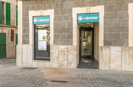 Porreres, Spain; January 22 2021: main facade of the Cajamar bank office on a sunny morning in the Majorcan town of Porreresのeditorial素材
