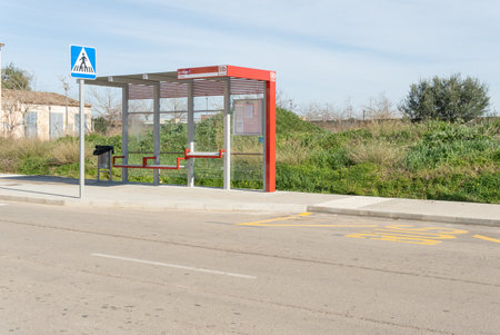 Campos, Spain; January 29 2021: new red TIB bus stops in the Majorcan town of Campos on a sunny dayのeditorial素材