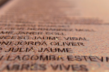 Porreres, Spain; February 11 2021: Monument for the reprisals of the Spanish Civil War called El RacÃ³ de la MemÃ²ria in the town of Porreres. Close-up of the iron plaques with the names of the victimsのeditorial素材