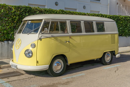 Colonia de Sant Jordi, Spain; February 13 2021: Yellow and white Wolkswagen T1 van parked in a sunny street in the Majorcan town of Colonia de Sant Jordiのeditorial素材