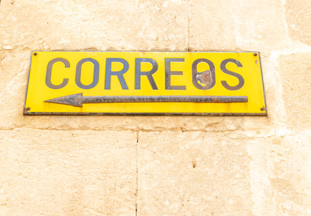 Manacor, Spain; March 18 2021: Close-up of an old poster of the company Sociedad Estatal de Correos y TelÃ©grafos de EspaÃ±a (Correos)のeditorial素材