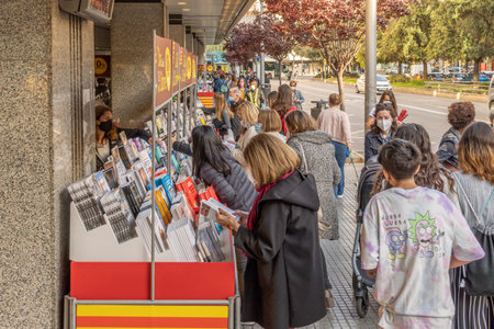 Palma de Mallorca; April 23 2021: Festivity of Sant Jordi or Book Day in the historic center of Palma de Mallorca in times of the Coronavirus pandemic. Facial mask and social distance. New normalのeditorial素材