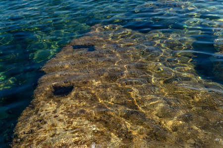 Texture of the Mediterranean Sea on a sunny morning with clean and clear water
