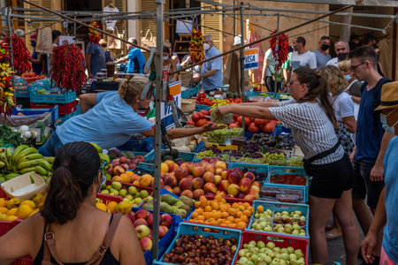 Sineu, Spain; September 08 2021: Weekly street market of food, crafts and animals in the Mallorcan town of Sineu in the Post-coronavirus period. New normality conceptのeditorial素材
