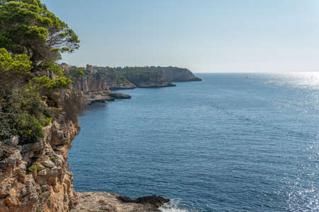 Aerial view of the rocky coast of the island of Mallorca on a sunny morning with the Mediterranean...