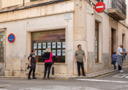 Porreres, Spain; October 31 2021: General view of a real estate agency with people looking in the shop windowのeditorial素材