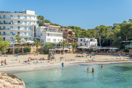 Cala Santanyi, Spain; September 11 2021: General view of Cala Santanyi beach on the island of Mallorca, with bathers on the sand and in the Mediterranean Sea on a sunny morningのeditorial素材