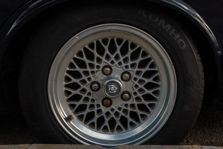 Llucmajor, Spain: december 05 2021: Daimler Double Six black car, parked on the street on a sunny day. Close-up of a wheel rimのeditorial素材