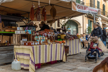 Santanyi, Spain; December 11 2021: Weekly street market in the Mallorcan town of Santanyi, during...