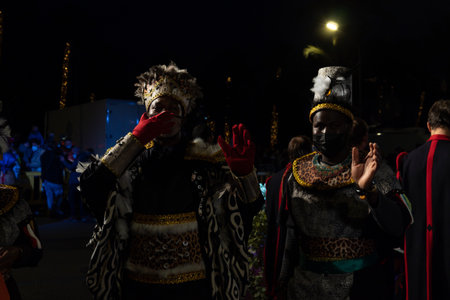 Palma de Mallorca, Spain; January 05 2022: Cavalcade of the Three Wise Men of the East, at Christmas time. Participants and public wearing face masks due to restrictions of the Coronavirus pandemicのeditorial素材