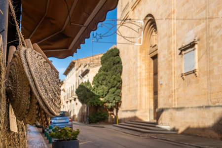 Close-up of a wicker basket of Mallorcan handcraft called Senalla. In the background, out of focus,...