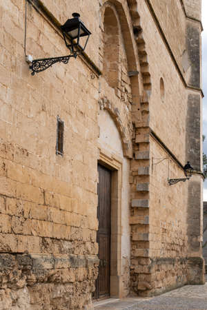 Main facade of the parish church of Sant Pere, located in the Majorcan town of Petra, on a sunny dayの写真素材