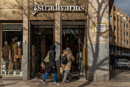 Manacor, Spain; january 20 2022: Facade of the multinational clothing and accessories company Stradivarius, a sunny morning with people wearing mask. new-normalのeditorial素材