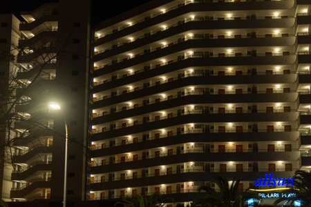 Palma Beach, Spain; March 14 2022: Main facade of the Pilari Playa hotel, part of the Allsun Hotels group, at night. Playa de Palma, island of Majorca, Spainのeditorial素材
