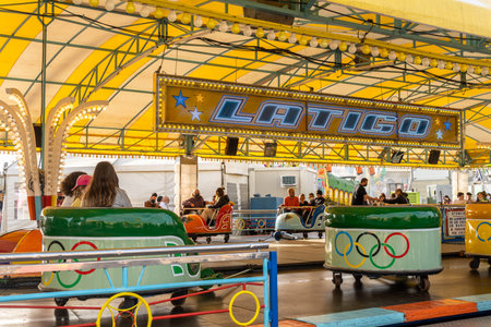 Palma de Majorca, Spain; april 08 2022: Attractions and people at the traditional annual fair, fira...