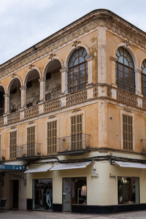 Manacor, Spain; December 01 2022: Old stately building in a state of abandonment, with commercial premises on the first floor. Manacor, island of Majorca, Spainのeditorial素材