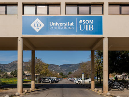 Palma de Mallorca, Spain; december 15 2022: Blue poster with white letters of the University of the Balearic Islands, Uib, a sunny morning. Island of Majorca, Spainのeditorial素材