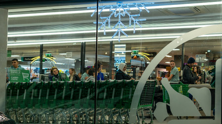 Manacor, Spain; december 17 2022: Facade of a Spanish supermarket chain, Mercadona, at night with...