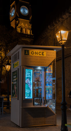 Manacor, Spain; december 17 2022: Lottery stand of the Spanish National Organization for the Blind, Once, illuminated at nightのeditorial素材