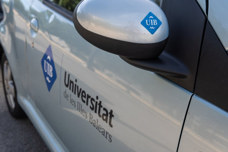 Palma de Mallorca, Spain; december 15 2022: Close-up of a parked gray car with the logo of the University of the Balearic Islands, UIB, island of Mallorca, Spainのeditorial素材