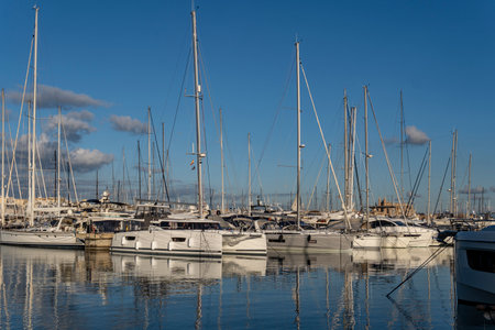 Palma de Mallorca, Spain; January 06 2023: Luxury yachts and sailboats moored in the harbor of the...