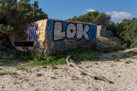 Sa Coma, Spain; February 17 2023: Former Spanish Civil War bunker on the beach of Sa Coma at dawn. Island of Majorca, Spainのeditorial素材