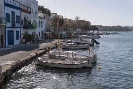 Playa de Palma, Spain; March 17 2023: General view of the seaport of the Mallorcan tourist town of Portocolom, at sunriseのeditorial素材