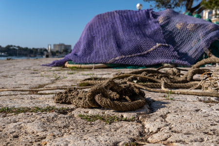 Close-up of fishing nets in the marina of the Majorcan town of Portocolom, Spainの写真素材