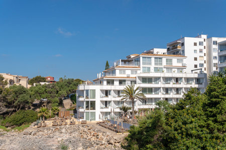 Portocolom, Spain; April 23 2023: Facade of a white tourist hotel in the Majorcan town of Portocolom, Spainのeditorial素材
