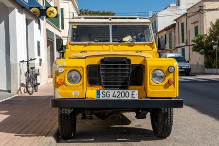 Portocolom, Spain; April 23 2023: Land Rover Santana yellow SUV, parked in the Majorcan town of Portocolom, Spainのeditorial素材