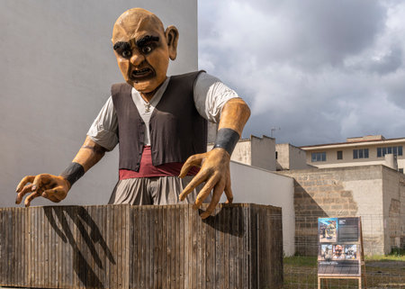 Manacor, Spain; April 30 2023: Manacor Encantat urban festival with large sculptures in the street of characters from folk tales or Rondalles. Sculpture of a giant with open arms. Manacor, Spainのeditorial素材