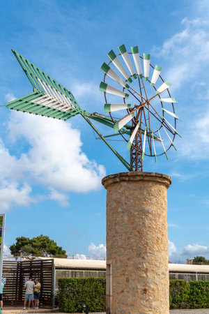 Sa Coma, Spain; June 03 2023: Green and white windmill typical of the island of Mallorca, Spainのeditorial素材