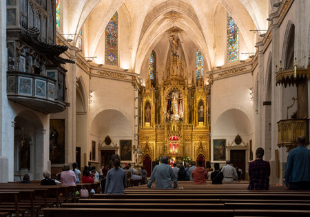 Felanitx, Spain; May 28 2023: Interior of the parish church in the Majorcan town of Felanitx, with the parish priest and parishioners celebrating Sunday mass. spainのeditorial素材