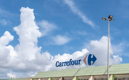 Sa Coma, Spain; May 19 2023: Main facade of the multinational hypermarket chain Carrefour, Sa Coma, Mallorca island, Spainのeditorial素材