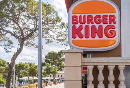 Porto Cristo, Spain; july 01 2023: Close-up of the logo of the multinational fast food company Burger King. Porto Cristo, island of Majorca, Spainのeditorial素材