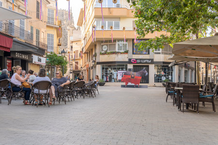 Manacor, Spain; July 21 2023: Terrace of the famous cafeteria Center Cultural S'Agricola with customers. Manacor, island of Majorca, Spainのeditorial素材