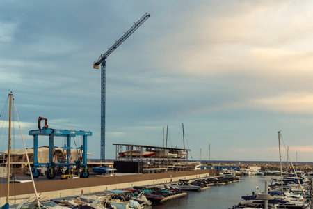 Palma de Mallorca, Spain; September 01 2023: General view of the marina in the tourist resort of Puerto Portals, island of Mallorca, Spain. An industrial crane for yachts restorationのeditorial素材