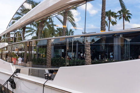 Palma de Mallorca, Spain; September 01 2023: General view of the marina in the tourist resort of Puerto Portals, island of Mallorca, Spain. Reflection of the window of a yachtのeditorial素材