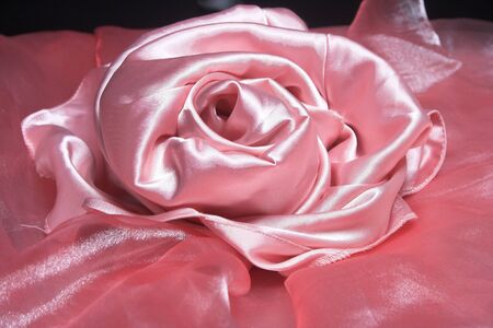 Rose from pink silk fabric.  Beautiful background.の写真素材