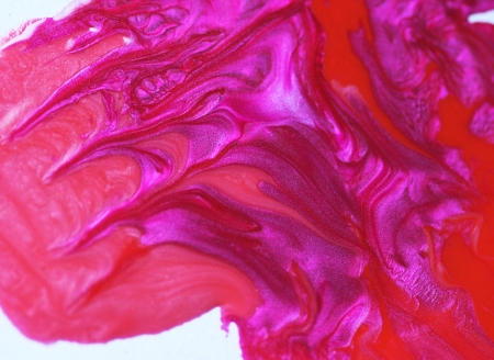 Pink and red nail polish drops. Background.の写真素材