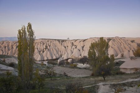 The sediments of volcanic tuff in Cappadocia near the Uchisar Castle in the evveningの写真素材