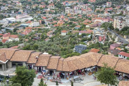 Kruja, Albania - 16 July 2017 : Tourists walking along Old market, looking for souvenirs and gifts