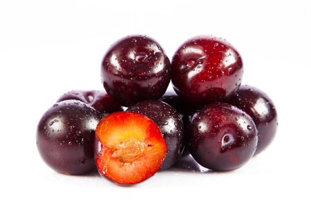 plums isolated on white backgroundの写真素材
