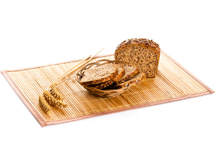 Brown seed biobread isolated on white background