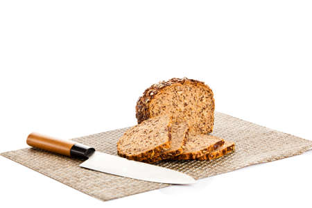 Brown seed bio bread isolated on white