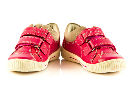 children shoes isolated  on white backgroundの写真素材