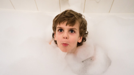 boy in foam bathroom hygiene. facebookの写真素材
