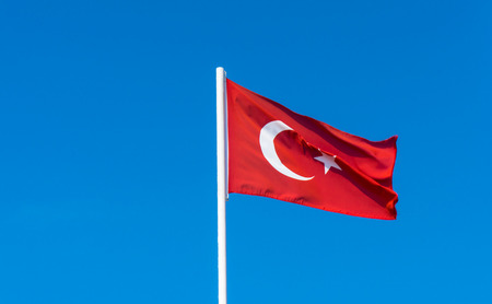 flag of Turkey on blue skyの写真素材