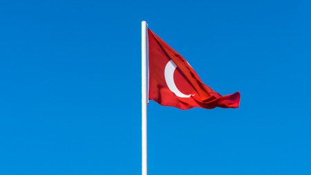 flag of Turkey on blue sky