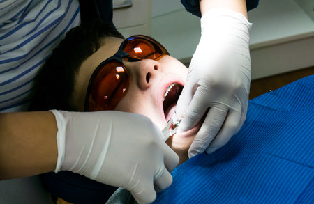 boy in dental treatment. brace. health careの写真素材